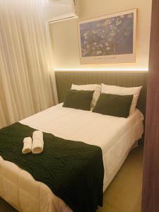 Postel nebo postele na pokoji v ubytování Apto de 2 quartos e Ar Condicionado perto do Praia Clube