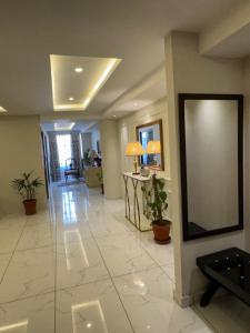 a lobby with a large projection screen on the wall at Bahria Sunrise Apartments in Rawalpindi