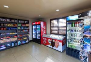 a coca cola store with two refrigerators and a soda at staySky Suites I-Drive Orlando Near Universal in Orlando