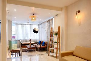 a living room with a couch and a table at The Nest in Varanasi