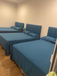 Ένα ή περισσότερα κρεβάτια σε δωμάτιο στο Villa Recinos