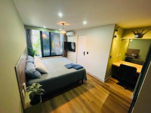 a small room with a bed and a bedroom with a desk at BIG HOUSE, máximo 22 personas !!!!!!!!!!!!!!! in Guadalajara