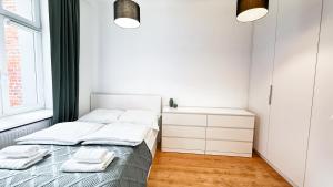 Postel nebo postele na pokoji v ubytování Nawrot Hideaway By DreamAp