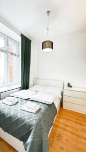 Postel nebo postele na pokoji v ubytování Nawrot Hideaway By DreamAp