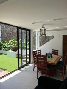 a dining room with a wooden table and chairs at BIG HOUSE, máximo 22 personas !!!!!!!!!!!!!!! in Guadalajara