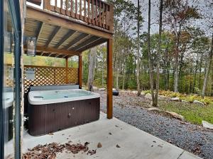 a hot tub under a deck on a house at Golden Crest in McHenry