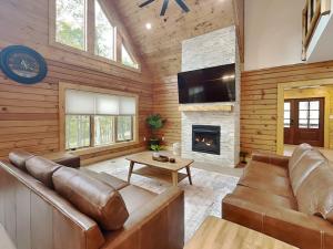 a living room with a couch and a fireplace at Golden Crest in McHenry +89 photos