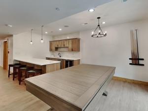 a kitchen with a large wooden table and chairs at Golden Crest in McHenry