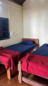 Ένα ή περισσότερα κρεβάτια σε δωμάτιο στο Hemashree Beach Stay Gokarna