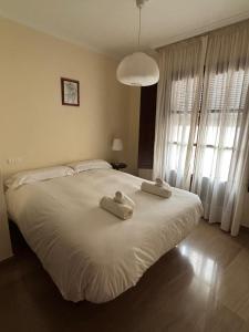 Postel nebo postele na pokoji v ubytování La Casa de Paquita