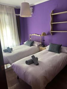 Postel nebo postele na pokoji v ubytování La Casa de Paquita