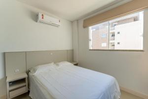 Ένα ή περισσότερα κρεβάτια σε δωμάτιο στο Apartamento 2 dormitórios em Bombas SC