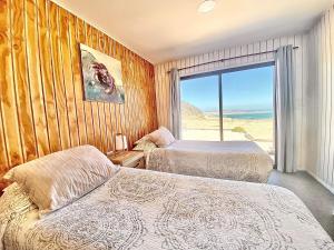 Postel nebo postele na pokoji v ubytování Casa Puntalodge