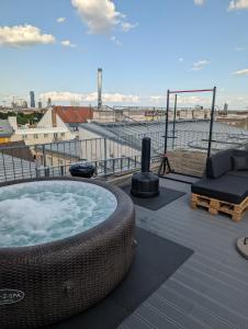 a hot tub on the roof of a building at Best Penthouse in Vienna, 7min to 1st district in Vienna