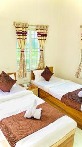 Кровать или кровати в номере The Green Haven Homestay