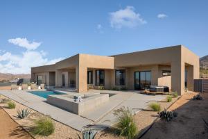 a house in the desert with a swimming pool at Sunstill by Fieldtrip Modern w Custom Pool Spa Views in Joshua Tree