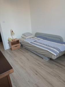 a bedroom with a bed and a nightstand next to it at Mikołowska 9 pokój in Gliwice