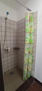 a bathroom with a shower with a shower curtain at БіднийЗаяць in Lebedevka