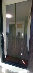 a glass window of a shower in a bathroom at БіднийЗаяць in Lebedevka