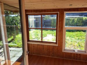 a room with two windows in a house at Joysha's House in Ikast