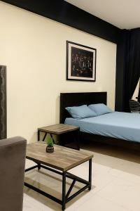 Voodi või voodid majutusasutuse Luxury Studio Apartment in B-17, MULTI GARDEN toas