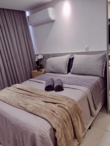 Ένα ή περισσότερα κρεβάτια σε δωμάτιο στο Brezze Residence pé na areia +25 φωτογραφίες