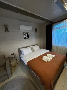 Ένα ή περισσότερα κρεβάτια σε δωμάτιο στο Bungarella Deluxe Bungalows