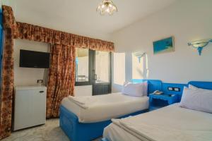 Ένα ή περισσότερα κρεβάτια σε δωμάτιο στο Geisum beach hotel +20 φωτογραφίες