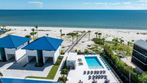 an aerial view of a resort with a pool and the beach at Shalimar Beach Resort in Sanibel