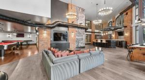 a living room with couches and ping pong tables at The Stay 2 - Navy Yard Washington DC in Washington, D.C.