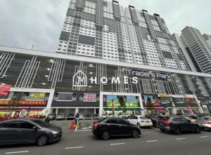 a parking lot in front of a large building at C180 Trader Park 3Room Balcony Free Parking #C13 in Cheras