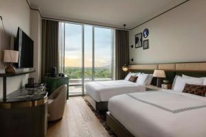 Ένα ή περισσότερα κρεβάτια σε δωμάτιο στο The Tess, Autograph Collection