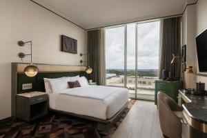 Ένα ή περισσότερα κρεβάτια σε δωμάτιο στο The Tess, Autograph Collection