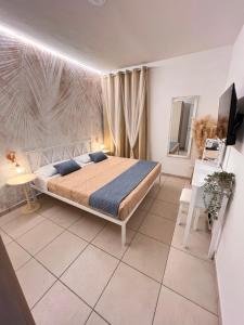 a bedroom with a bed and a television in it at Casa Jeyel in Lazise