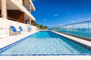 Πισίνα στο ή κοντά στο SeaDreams 5 - Luxury Condo with Shared Pool, Hot Tub, Rooftop Lounge