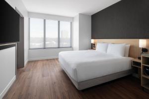 Postel nebo postele na pokoji v ubytování Hyatt Place Bozeman Yellowstone Airport