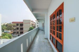 an empty balcony with a view of a city at Hotel O Krupa Service Apartments in Hyderabad