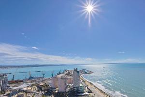 a view of a city and the ocean with buildings at Lux Holidays 221 in Durrës