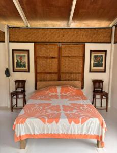 Una cama o camas en una habitación de Fare Malou