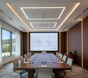 a large conference room with a long table and chairs at THE PERLA Bodrum HOTEL in Bodrum City +17 photos