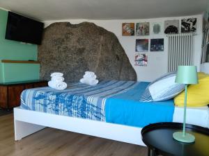 a bedroom with a bed with two teddy bears on it at Cech Coast House in the Woods in Civo +27 photos