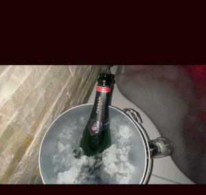a bottle of beer in a bowl of snow at B&B La Perla & Suites in Bari +40 photos