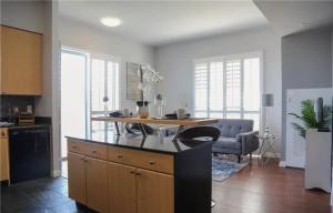 a kitchen with a island in the middle of a room at One Bedroom Condo with Ocean and Marina Views in Long Beach