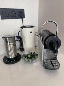 a coffee maker and a toaster on a counter at u Mari in Piešťany +12 photos