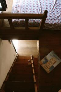 an overhead view of a bedroom with a bed and a book at Traditional Cycladic house in Serifos Chora