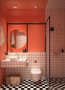 a bathroom with a toilet and two sinks and a mirror at Vere Side Rooms in Tbilisi City +59 photos