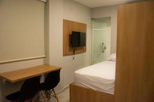 TV a/nebo společenská místnost v ubytování HN Pariquis - Estúdios com padrão Anfitrião 360 em Batista Campos