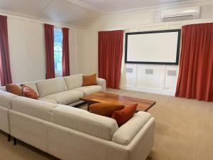 a living room with a couch and a table at Wandering Trout in Mole Creek