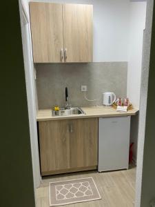 Η κουζίνα ή μικρή κουζίνα στο Elyisian Home