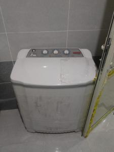 a white toilet sitting in a bathroom stall at Melia house in Marsa Alam City